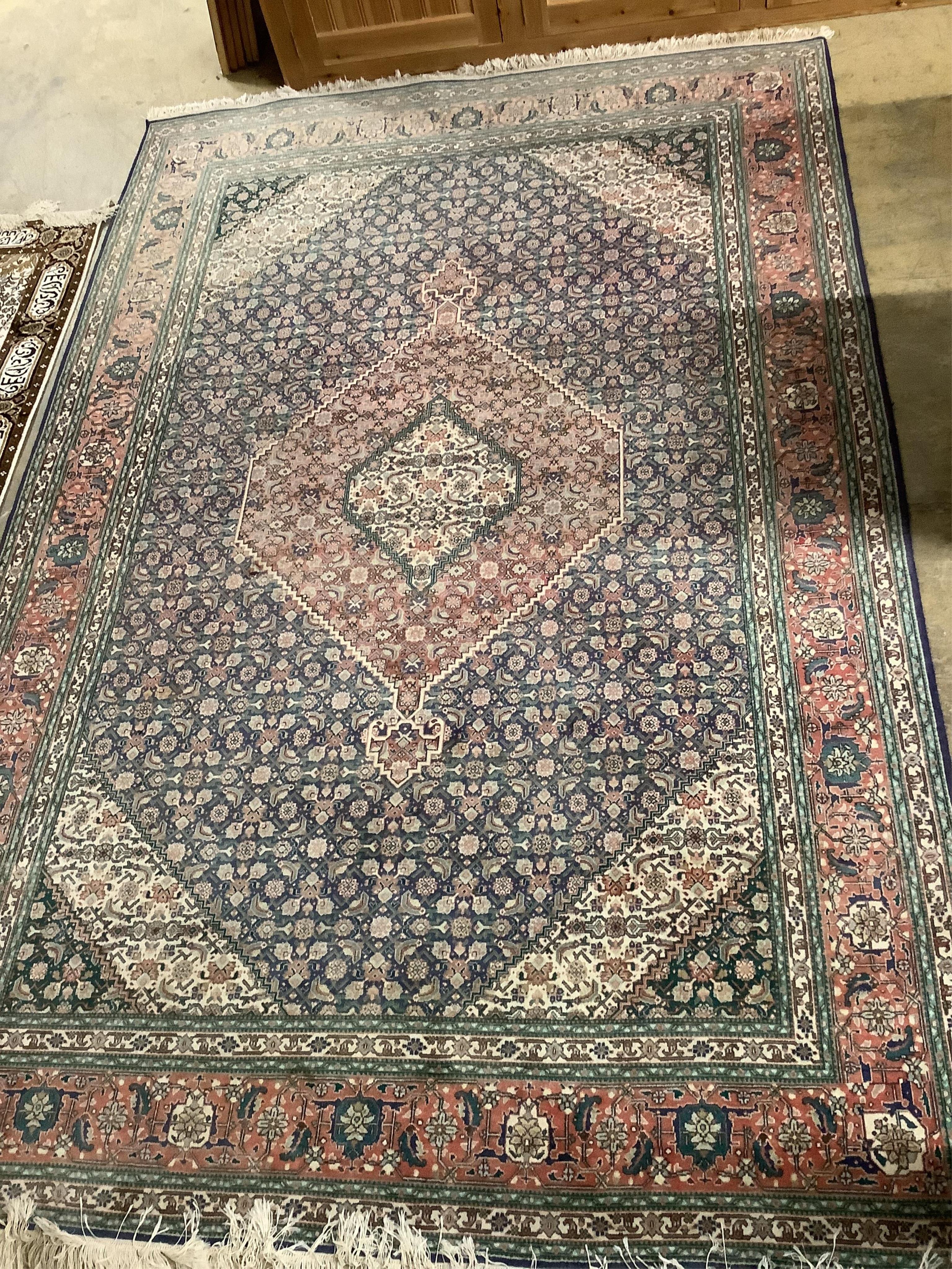 An Iranian blue ground carpet, 300 x 200cm. Condition - fair